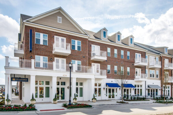 The Kathryn apartments with elegant brick construction and large balconies.