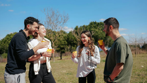Friends laughing together outside.